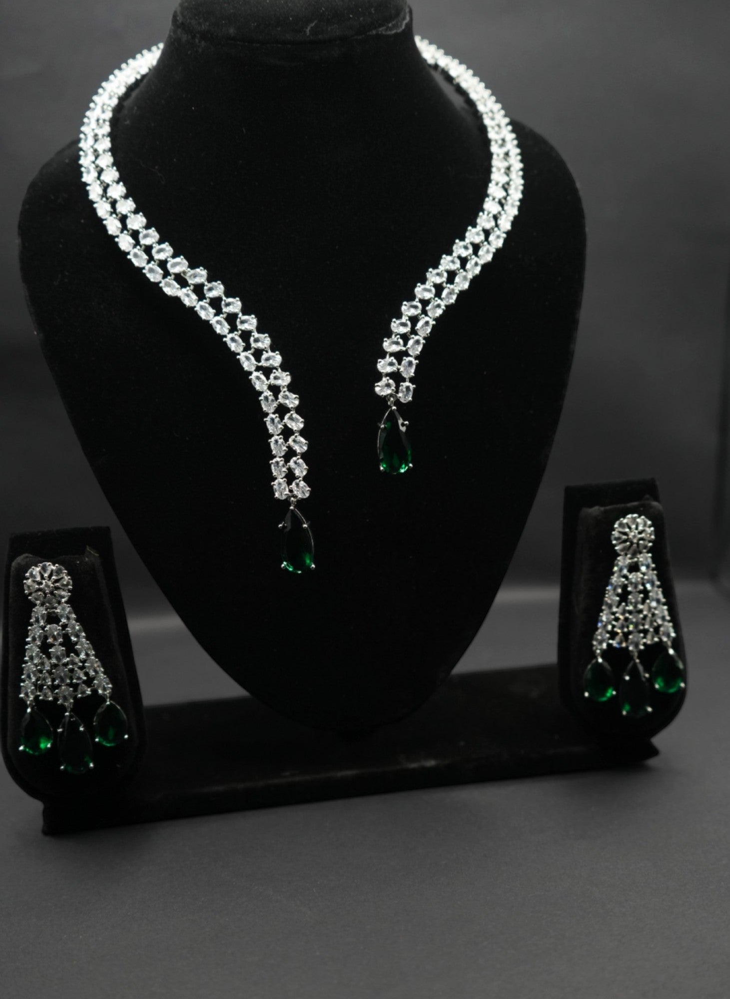 Elegant emerald and crystal necklace and earring set.