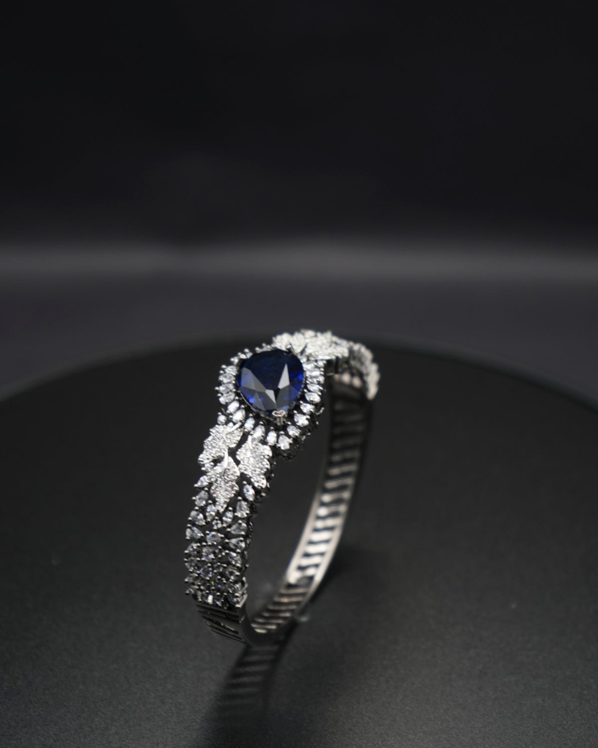 Sapphire Sparkle: Zircon-Accented Bangle Bracelet