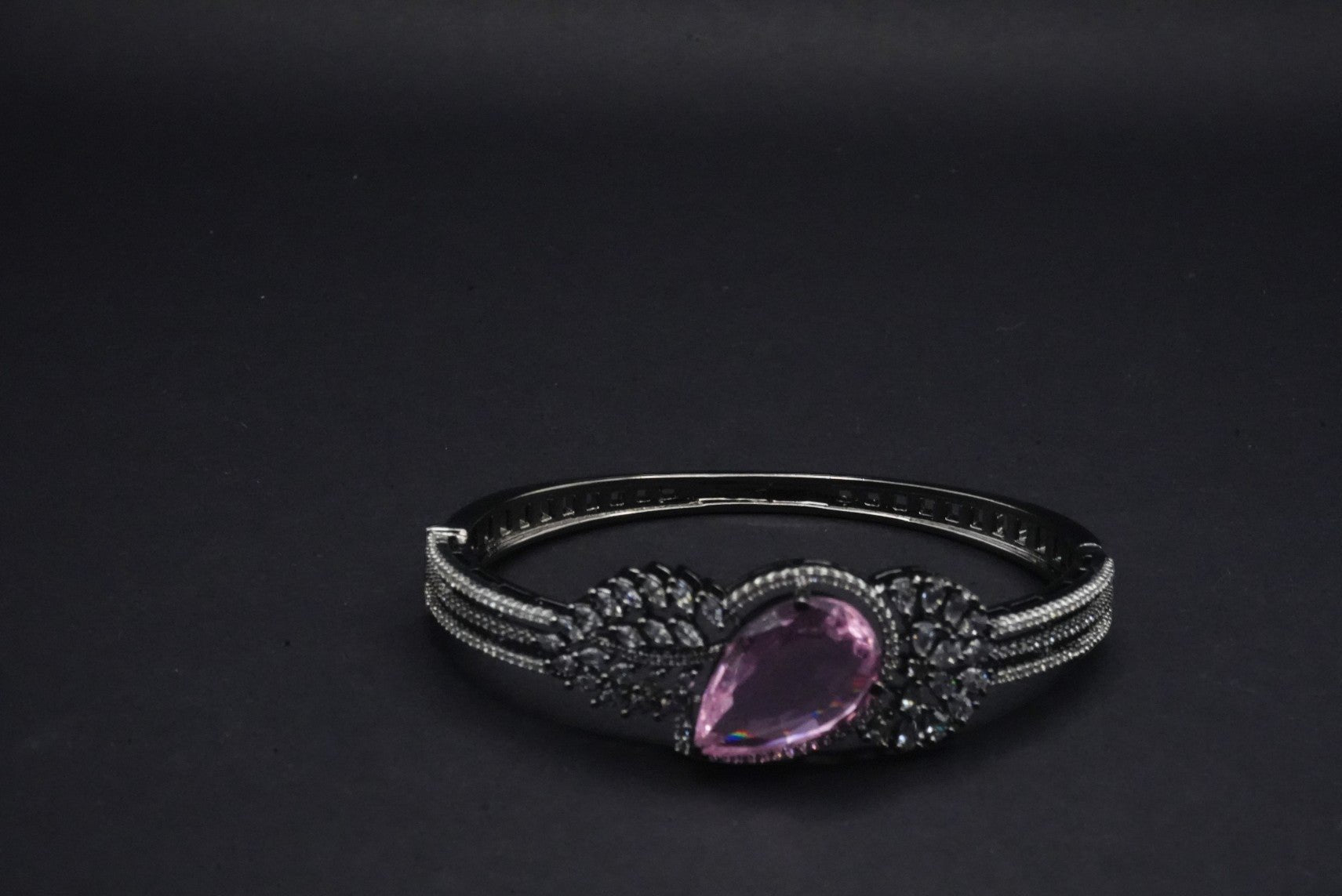 Stunning  Bangle with Purple Teardrop Gemstone and Leaf Motif Detailing