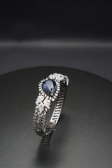 Sapphire Sparkle: Zircon-Accented Bangle Bracelet