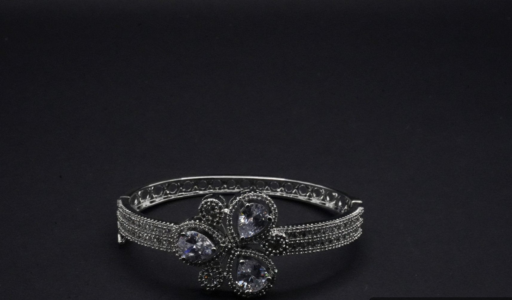 Gorgeous Silver Coated Bangle with Floral Motif and Teardrop Crystal Accents