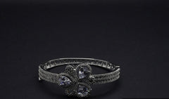 Gorgeous Silver Coated Bangle with Floral Motif and Teardrop Crystal Accents