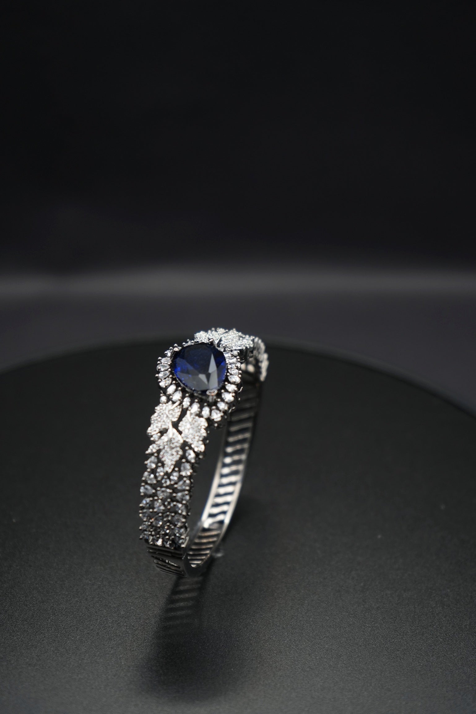 Sapphire Sparkle: Zircon-Accented Bangle Bracelet